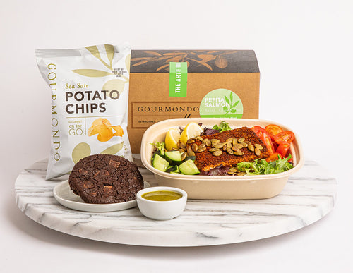 Box lunch: Salad spiced salmon, tomatoes, cucumbers, and lemon wedges, with cookie and chips on side