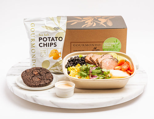 Box lunch: salad with steak, black beans, and tomatoes, with side of chips and cookie