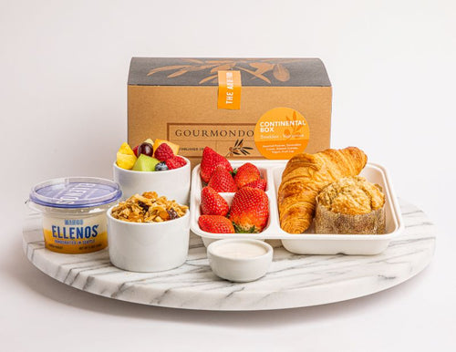 Boxed breakfast with pastries, fresh strawberries, granola, fruit cup, and yogurt