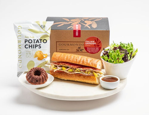 classic grinder sandwich with cured meats, slaw, and  cheese on baguette: as a box lunch with chips, salad, and mini chocolate dessert