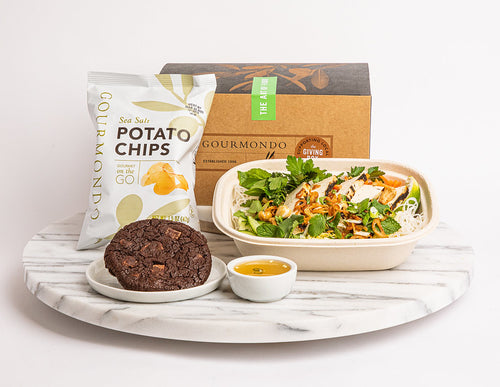 Box lunch with tofu noodle bowl entree, chips, and chocolate cookie