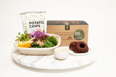 Boxed lunch with salad, potato chips, and bundt cake