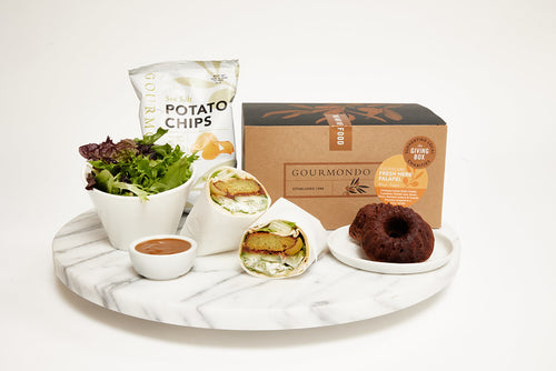 boxed lunch with falafel wrap, side salad, chips, and bundt cake