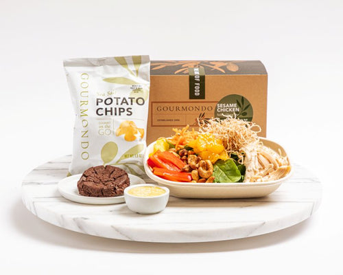 Boxed lunch with asian chicken salad, chips, and cookie 