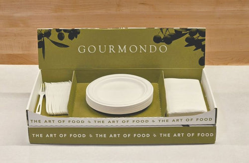 Cardboard box with compostable plates, napkins, and cutlery