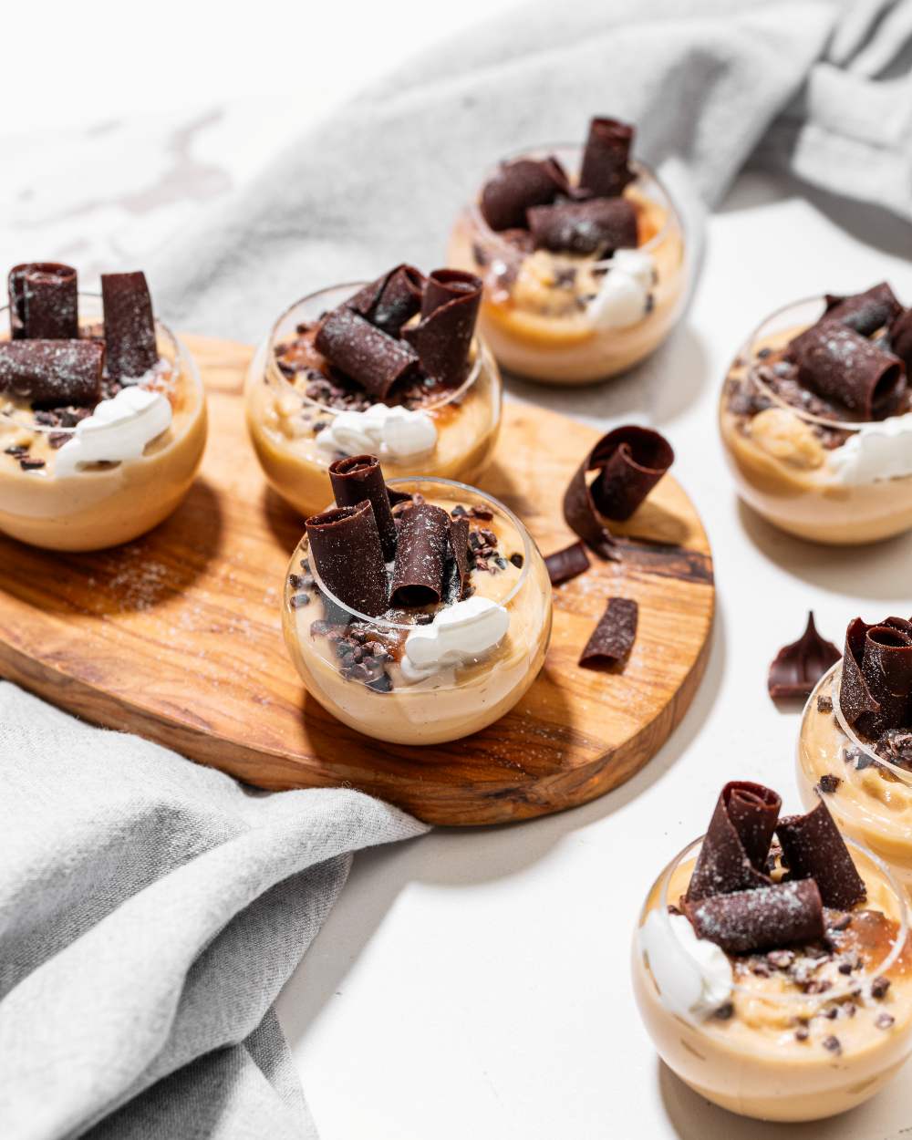 Butterscotch Budino, chocolate pearls, chocolate curls, sour cream