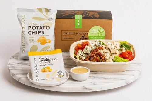 boxed lunch with cobb salad, chips, and cookie 