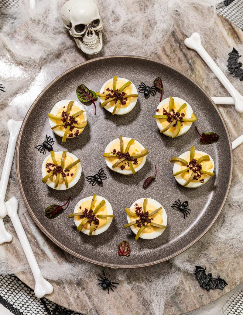 Deviled eggs with halloween theme, with skulls and crossbones