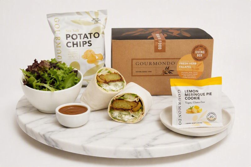 boxed lunch with falafel wrap, side salad, chips, and cookie