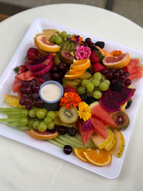 Tray of fresh cut fruit and berries