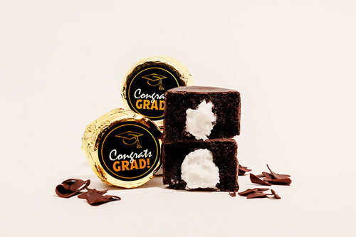 Mini chocolate cakes enrobed in chocolate filling, with custom "Congratulations Graduate" sticker