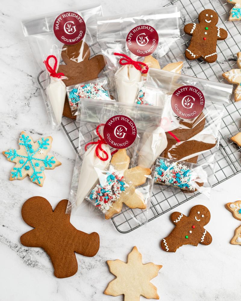 Gingerbread and snowflake cookies with icing and sprinkles to decorate
