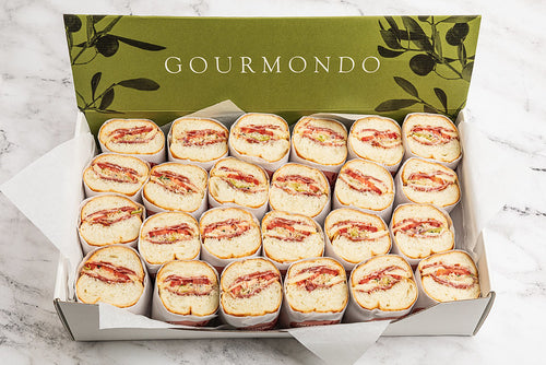 Sandwich halves in a box displaying the cut portion to show the filling