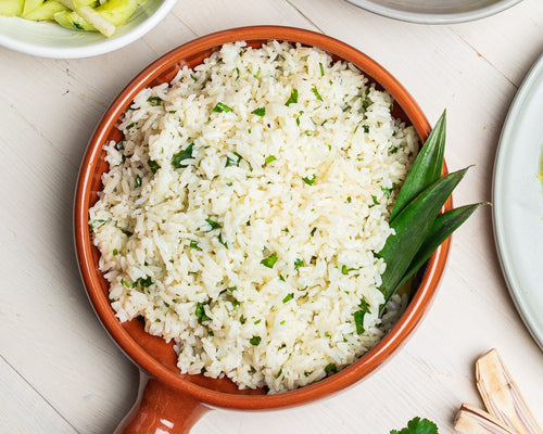 Serving dish with jasmine rice with lime leaves