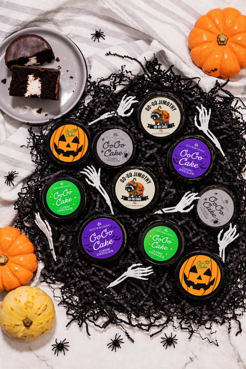 Gourmondo Halloween chocolate Go-Go Cakes with colorful seasonal stickers and Jimothy raccoon design, available from Seattle catering company Gourmondo.
