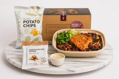 boxed lunch with mesquite salmon bowl, potato chips, and cookie 