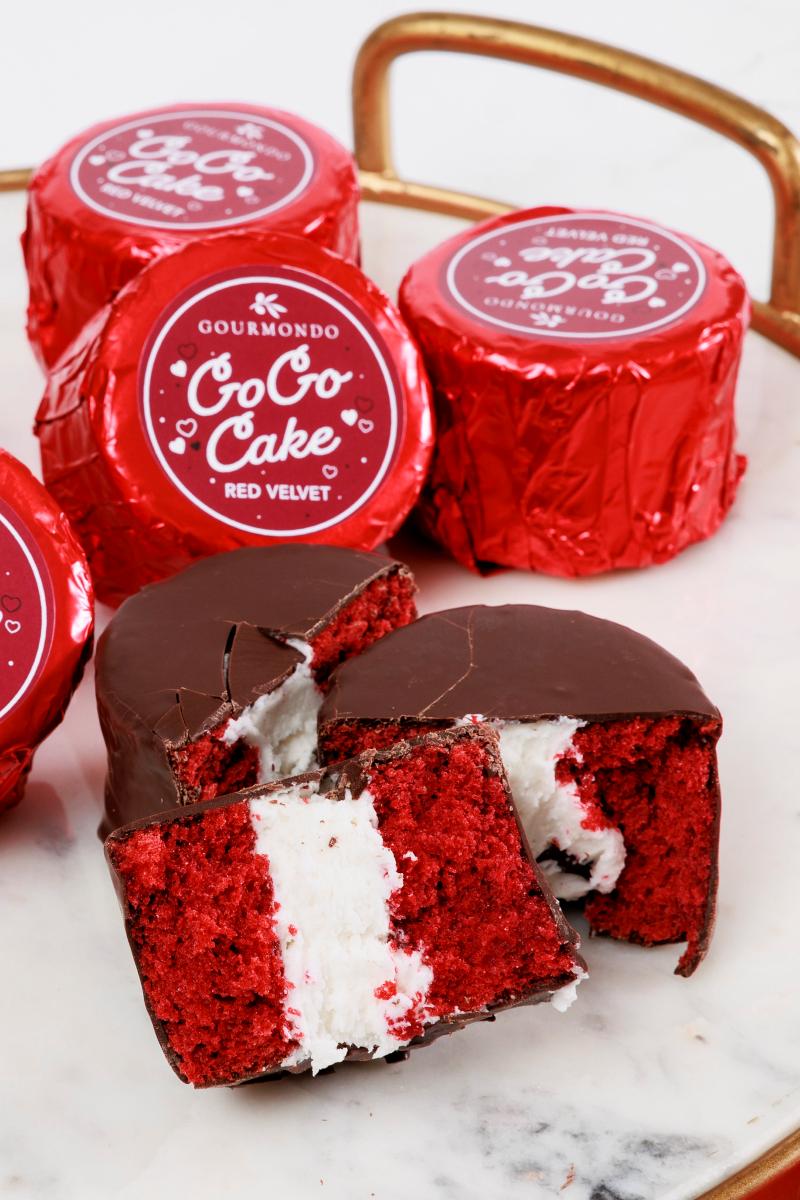 Classic red velvet cake with creamy filling, enrobed in chocolate