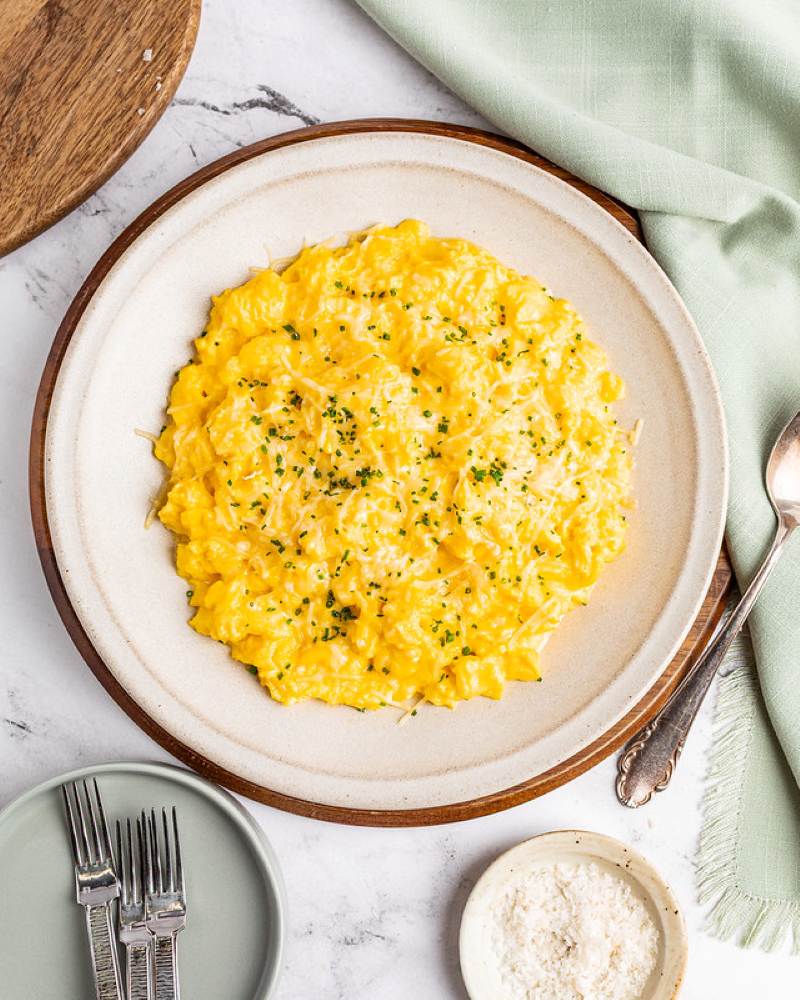 Creamy classic scrambled eggs topped with herbs