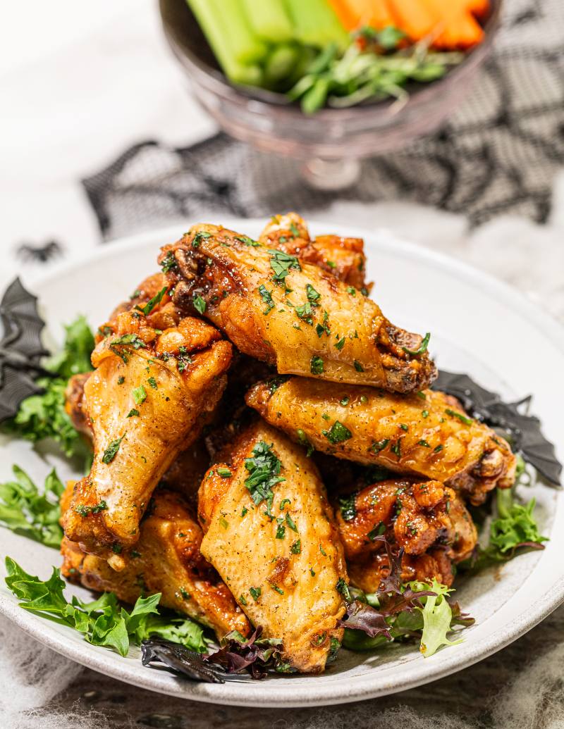 Chicken wings stylized as "bat wings" spiced roasted chicken wings glazed with Moroccan spices