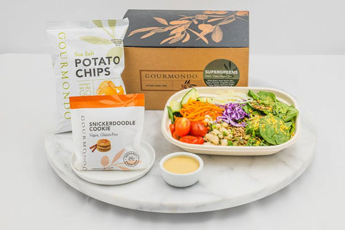 Healthy Supergreens boxed lunch from Gourmondo with mixed greens salad, fresh vegetables, house dressing, potato chips, and a gluten-free snickerdoodle cookie.