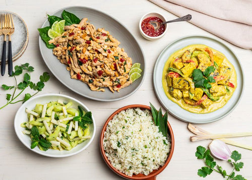 Thai chicken, yellow tofu curry, cucumber-jicama salad, and white rice as a package meal