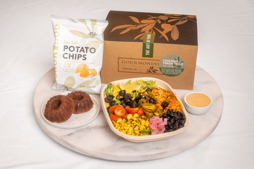 Boxed lunch with chicken taco salad, potato chips, mini bundt cake 