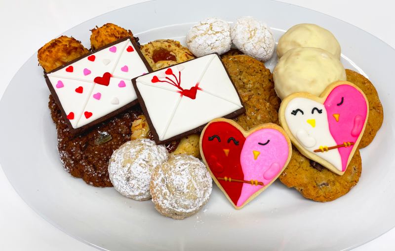 Assorted cookies featuring Valentine's hearts and envelope frosted sugar cookies